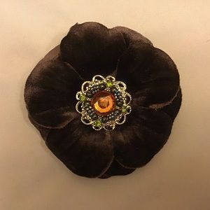 Brown velvet flower pin.